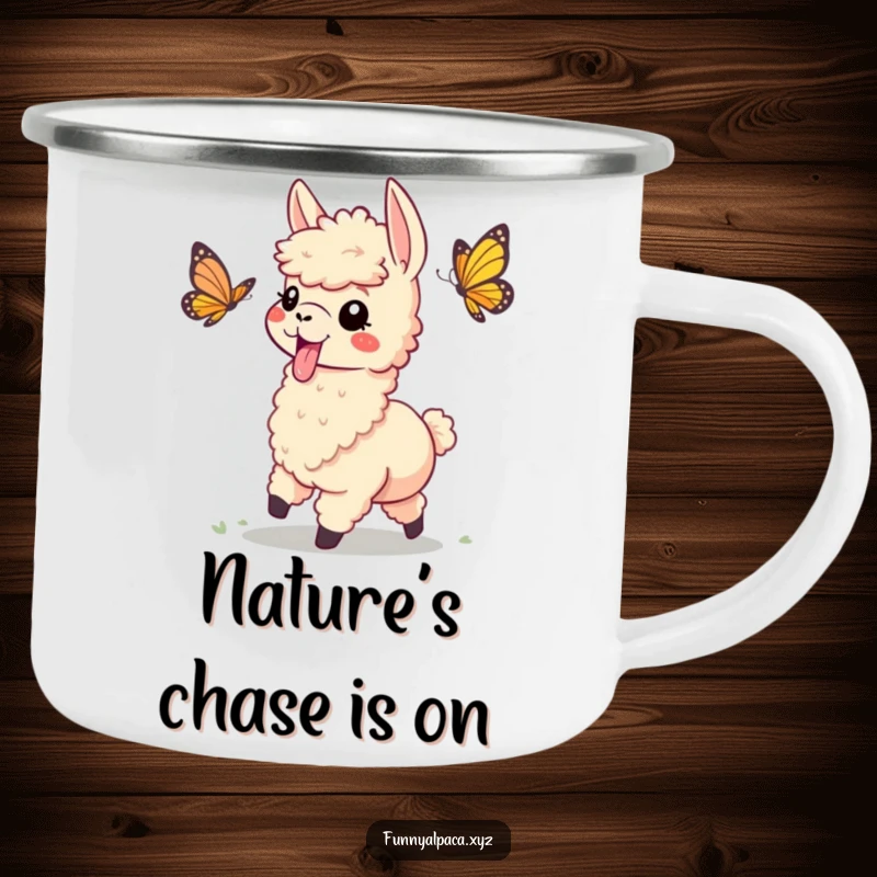 Funny enamel camping mug with a playful alpaca, tongue sticking out, chasing a butterfly, perfect for fun outdoor moments.