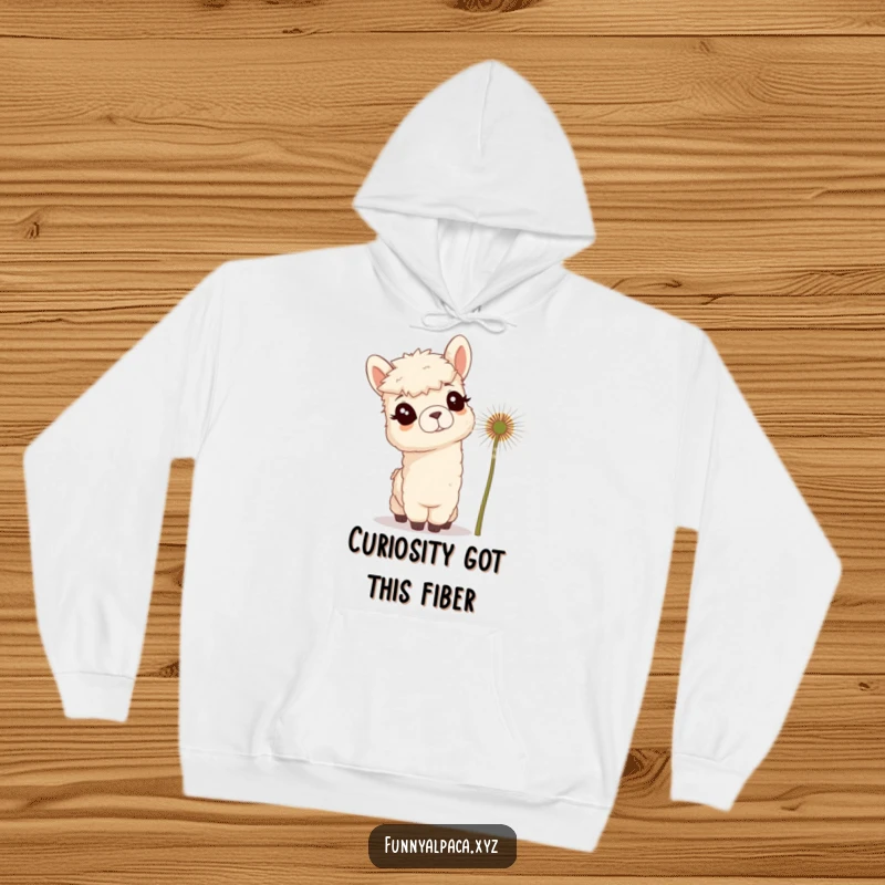 Funny hoodie featuring a curious alpaca with tufted ears tilting its head towards a giant dandelion, radiating innocent wonder.