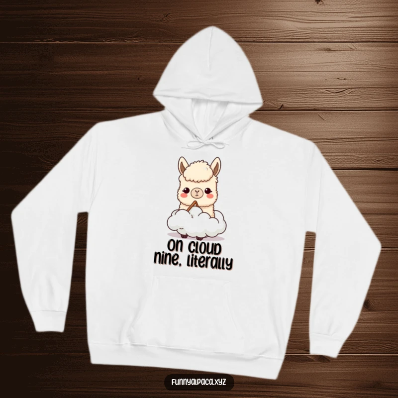 Funny hoodie featuring a content alpaca character enjoying chewing on a soft cloud, evoking comfort, creativity, and a humorous, relaxed vibe.